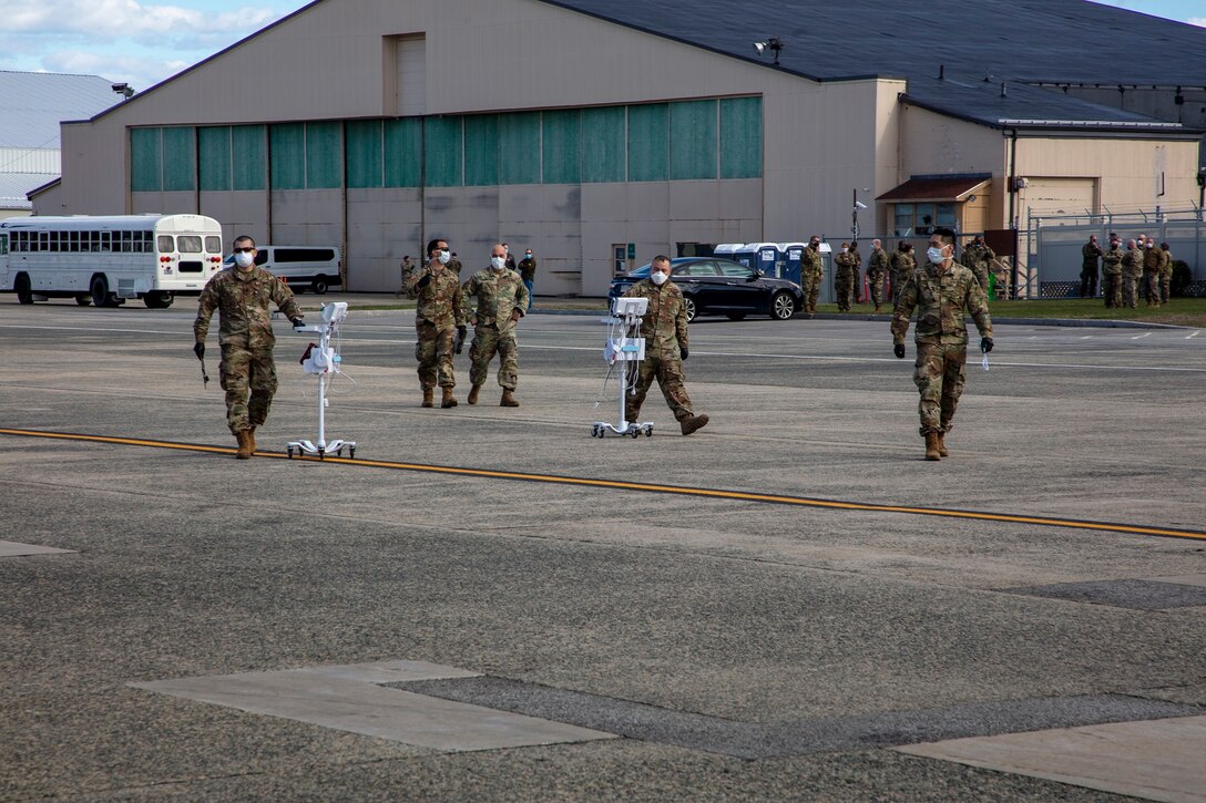 Members of 801st Combat Support Hospital, U.S. Army Reserve, Fort Sheridan, Illinois, arrive on Hanscom Air Force Base