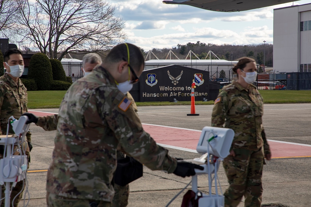 Members of 801st Combat Support Hospital, U.S. Army Reserve, Fort Sheridan, Illinois, arrive on Hanscom Air Force Base