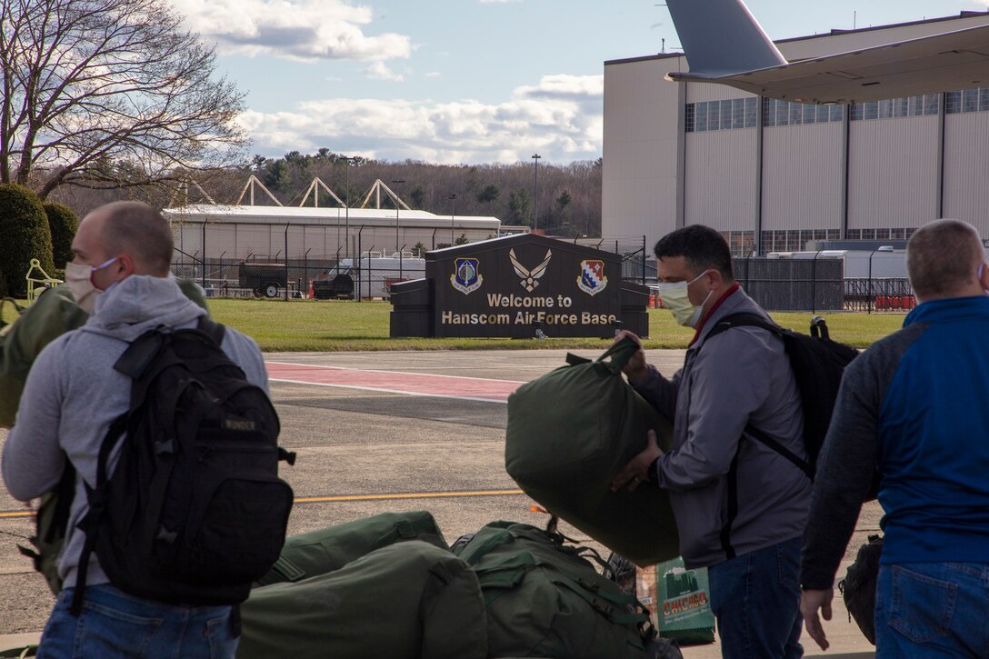 Members of 801st Combat Support Hospital, U.S. Army Reserve, Fort Sheridan, Illinois, arrive on Hanscom Air Force Base