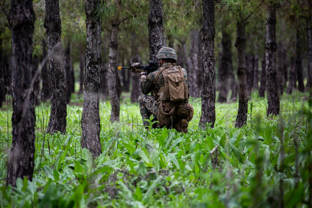 A U.S. Marine provides security during squad attack drills at Morón Air Base, Spain, April 9.