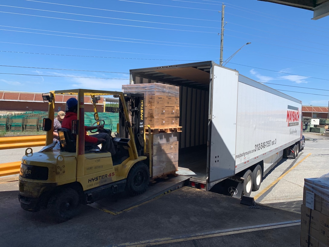 James Jackson, a material expeditor for the Defense Security Cooperation Agency, loads the truck arranged by the Defense Logistics Agency to begin the movement of the 154,000 N95 masks to the U.S. Transportation Command’s Patient Movement Item Center at Scott Air Force Base, Illinois.