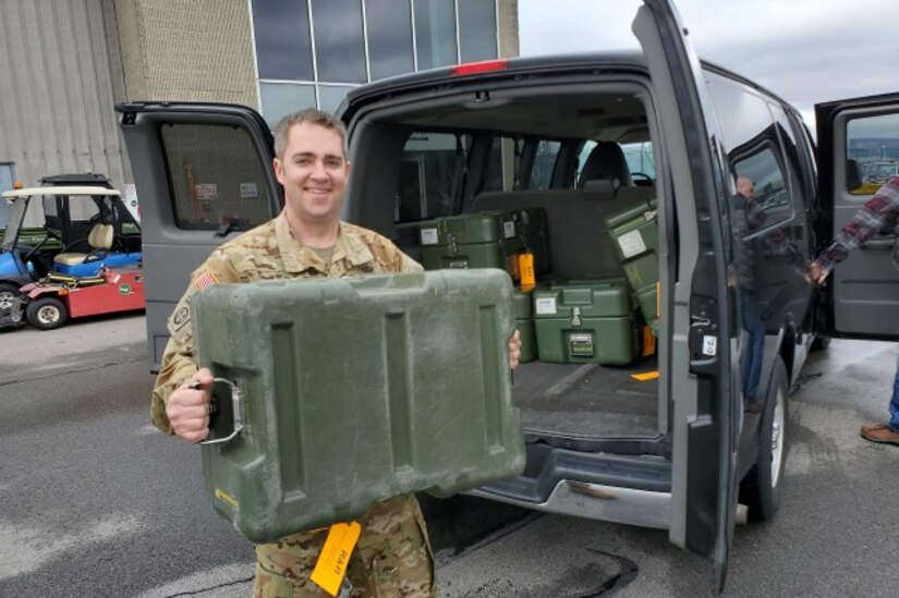 Chief Warrant Officer 3 Daniel Button is pictured handing off ventilators to the Georgia Air National Guard on April 3 following maintenance operations at Tobyhanna Army Depot.