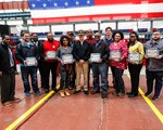 Shipyard Commander Capt. Kai Torkelson with employees who were selected as second quarter force multipliers.