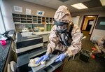Members of the West Virginia National Guard’s Task Force Chemical, Biological, Radiological and Nuclear (CBRN) Response Enterprise (CRE) (TF-CRE) sanitize workspaces for the West Virginia Higher Education Policy Commission in Charleston April 11, 2020.