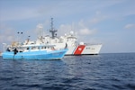 Coast Guard Cutter Mohawk (WMEC-913) members conduct a boarding of the Amanda M fishing vessel in the Eastern Pacific Ocean off the coast of Central America, April 9, 2020. During the boarding, the crew discovered several false compartmen