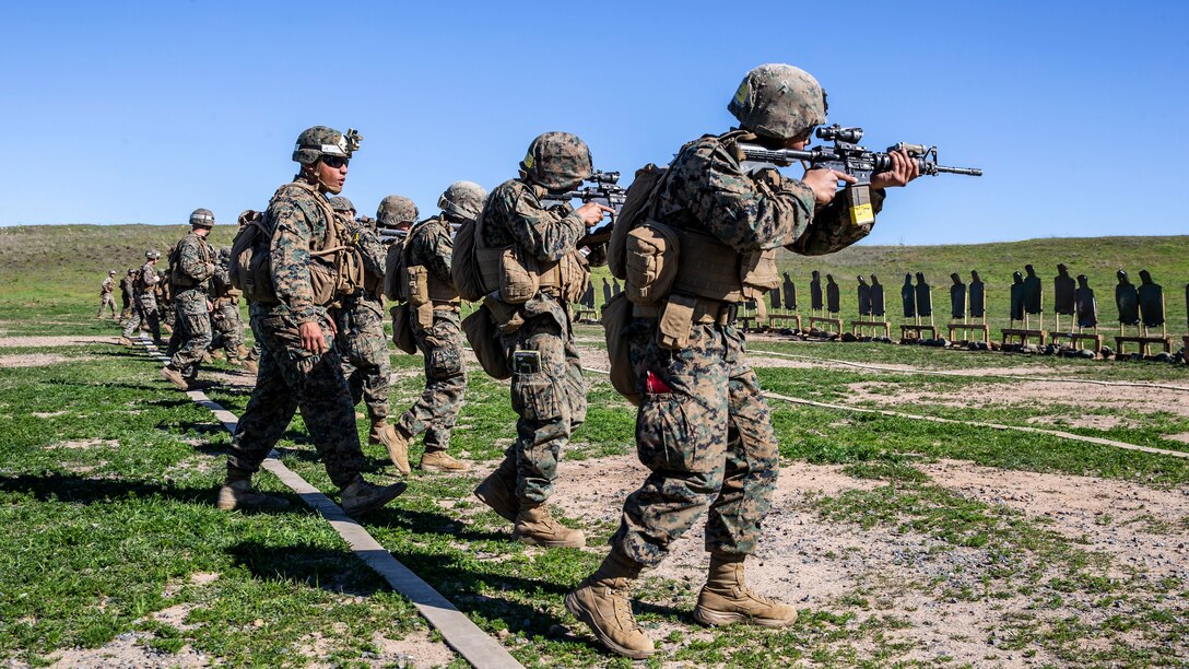 U.S. Marines with Charlie Company Class 7-20, Infantry Training Battalion, School of Infantry - West, fire a hammer pair while closing with their targets during a live-fire range at Range 210F on Marine Corps Base Camp Pendleton, California, Feb. 25, 2020. The range consisted of Tables 5 and 6, two parts of the Marine Combat Marksmanship Program. The objective of marksmanship training is to develop, sustain, and improve individual combat shooting skills. (U.S. Marine Corps photo by Lance Cpl. Alison Dostie)