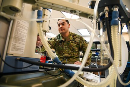 U.S. Army Staff Sgt. Jesus Rivera tests an anesthesia machine for leaks and functionality at the USAMMA MMOD-UT depot, Hill Air Force Base, Utah, Jan. 10, 2018. The unit's biomedical equipment technicians test and validate repaired and new equipment before sending those assets to unit. (U.S. Air Force photo by R. Nial Bradshaw)