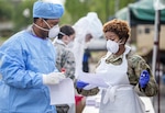 Louisiana National Guard Soldiers and Airmen collect nasal swabs