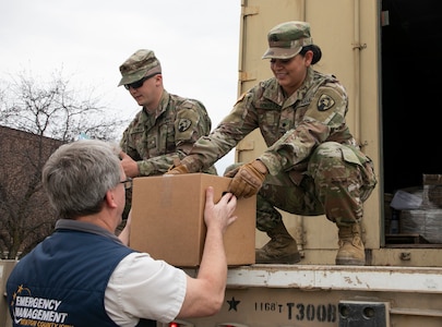 Spc. Janet Fonseca, a motor transport operator with the 1168th Transportation Company, Iowa Army National Guard, delivers medical supplies to Benton County emergency personnel in Vinton, Iowa, April 8, 2020. Fonseca and her husband, Pfc. Cesar Galvan, are both serving on state active duty in the 1168th to transport medical personal protective equipment to help combat the spread of COVID-19.