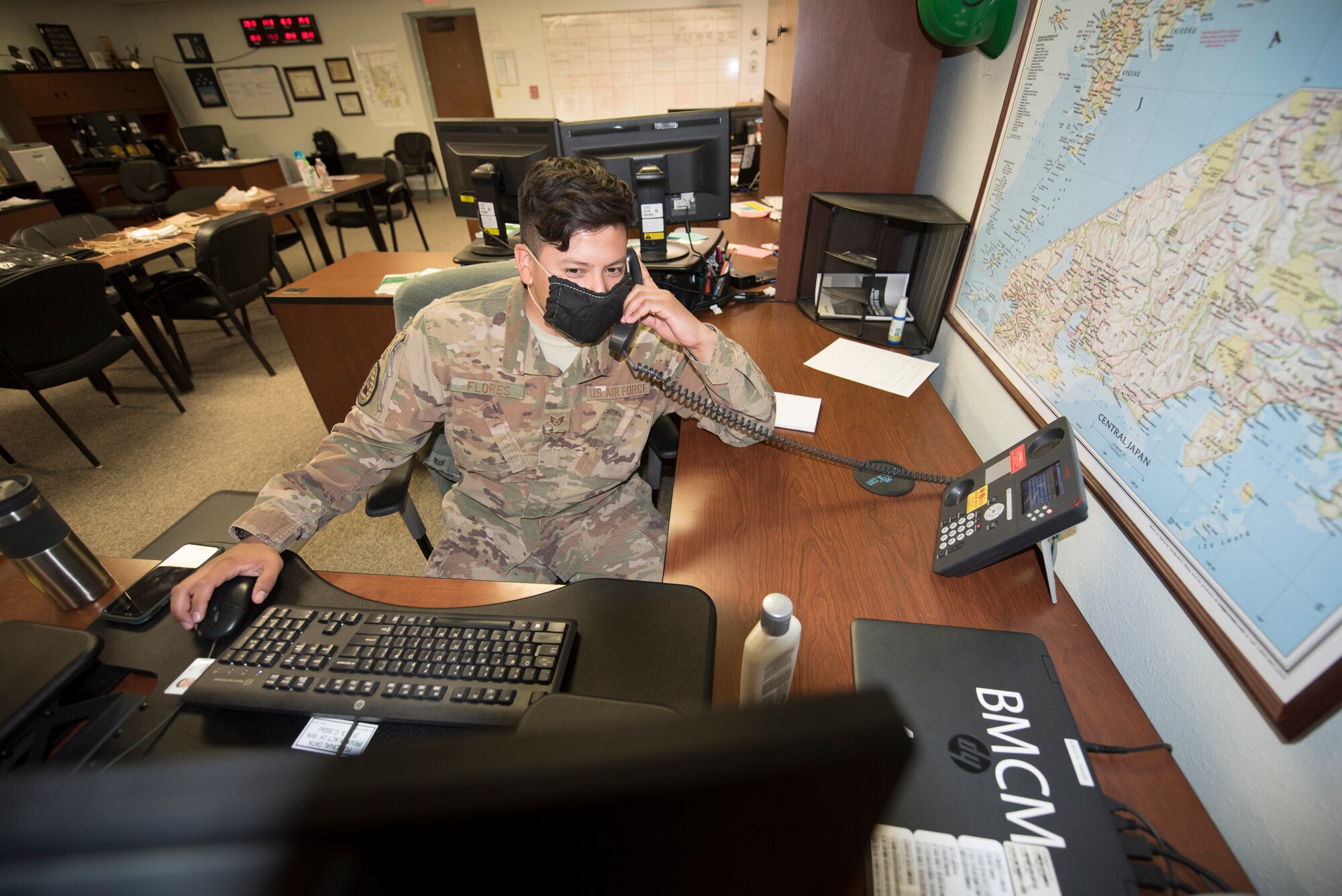 Staff Sgt. Enrique Flores, a container control officer from the 635th Materiel Maintenance Group, discusses the arrival of BEAR Base personnel to Joint Base San Antonio-Lackland, Texas on April 9, 2020. Flores is on a team of 635th MMG Airmen who are tracking the personnel and 1.2 million pounds of cargo support from Holloman Air Force Base. These expert Airmen and this vital equipment will help ensure that the Air Force’s basic training pipeline will endure throughout the COVID-19 response. (U.S. Air Force photo by Tech. Sgt. Matthew Rosine)
