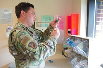 Staff Sgt. Jacob Radford, an allergy and immunizations technician assigned to 628th Health Care Operations Squadron, prepares an injection at the immunizations clinic on Joint Base Charleston S.C., April 7, 2020. Immunizations personnel have been taking safety precautions such as screening all patients before treatment, physical distancing, wearing masks and gloves, frequently cleaning work stations, and washing their hands before and after touching a patient. (U.S. Air Force photo by Airman Sara Jenkins)
