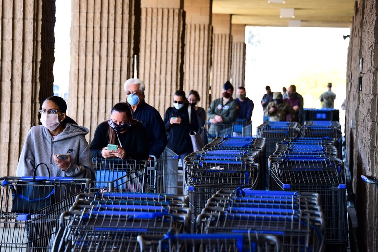 A photo of patrons waiting to enter the commissary