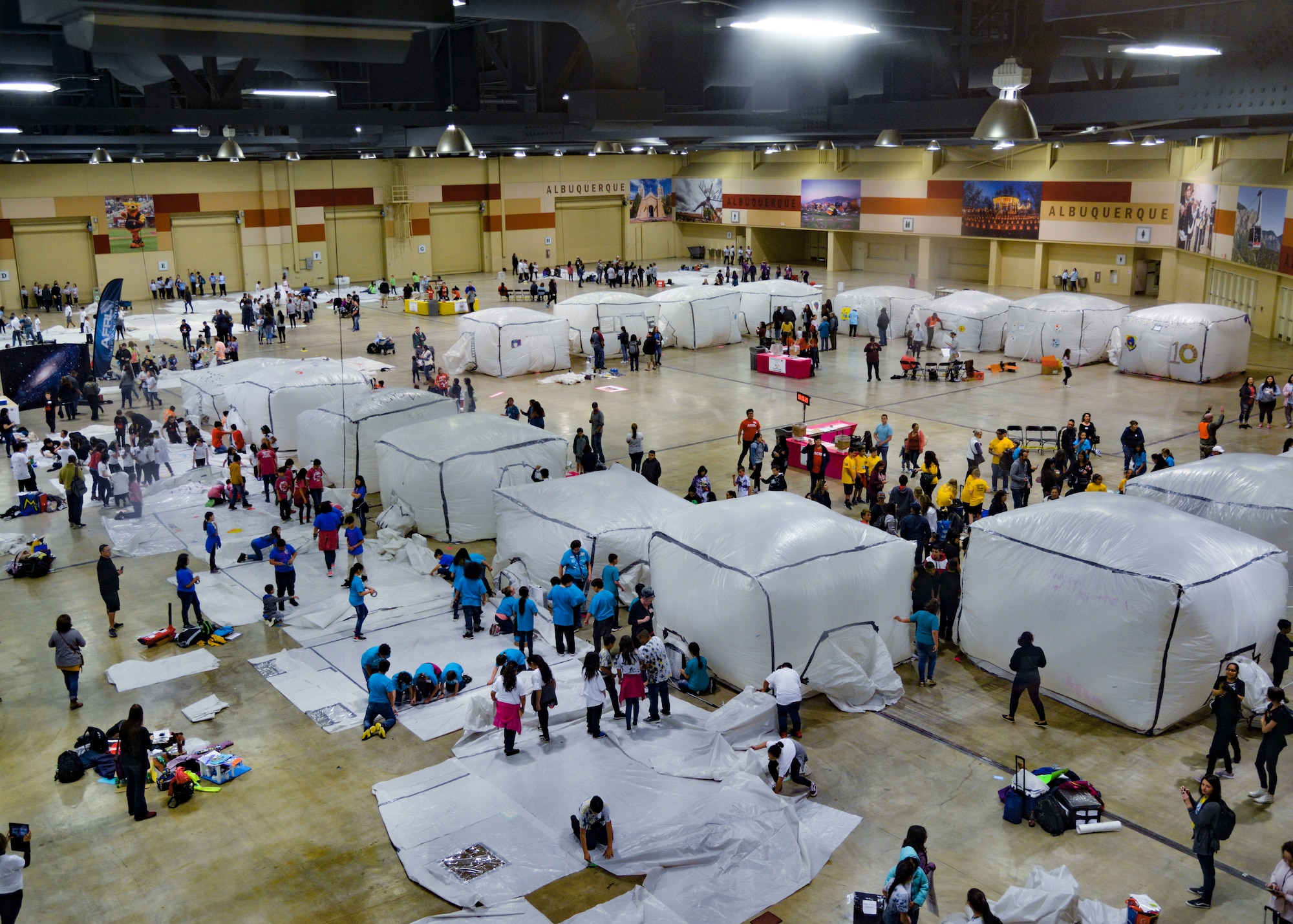 photo of students and inflatable cubes inside a convention center