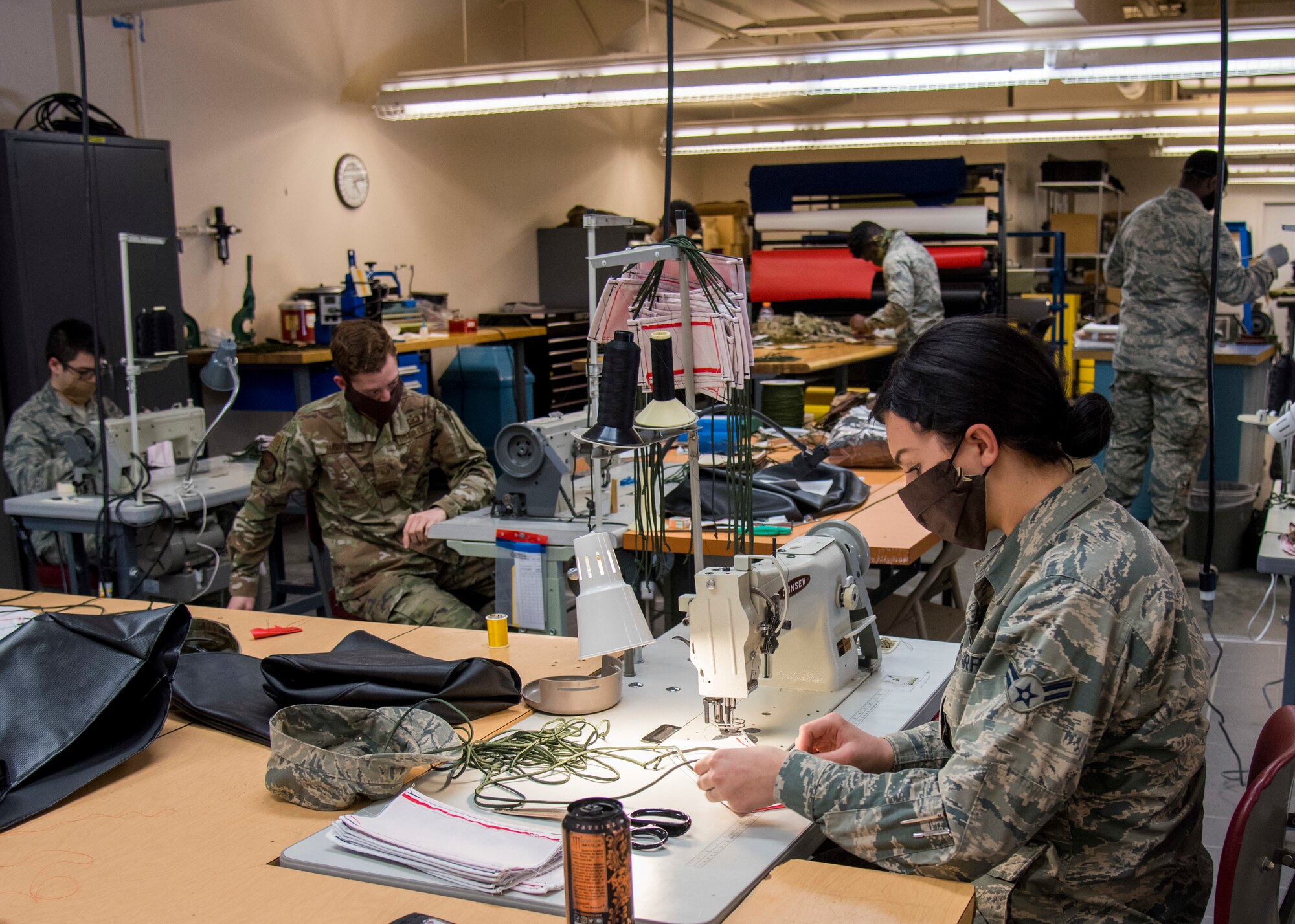 U.S. Air Force Airmen from the 92nd Operation Support Squadron Aircrew Flight Equipment unit create protective facemasks for Airmen at Fairchild Air Force Base, Washington, April 10, 2020. The task of creating protective facemasks may be outside the AFE unit’s expertise, however, their broad skill set and technical training enables them to meet this need in support of Airmen and enabling Fairchild’s mission success. (U.S. Air Force photo by Senior Airman Jesenia Landaverde)