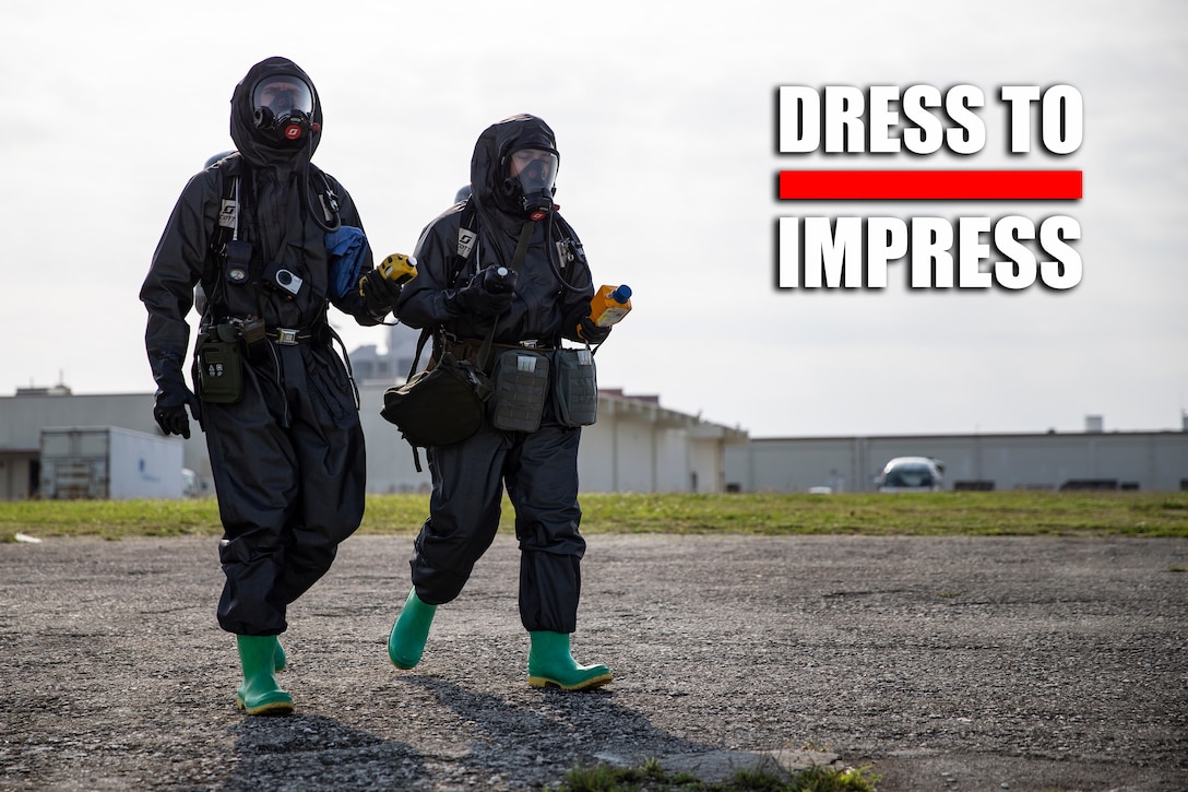 U.S. Marine Corps Lance Cpl. Thomas Moore, left, and Lance Cpl. Jordyn Parker respond to a chemical, biological, radiological and nuclear scenario during an enhanced CBRN response final exercise on Camp Kinser, Okinawa, Japan, April 2, 2020. The purpose of the exercise was to standardize CBRN procedures for Marines with 3rd Marine Logistics Group, 3rd Marine Division and 1st Marine Aircraft Wing. Moore, a native of Lawrence, Kansas, is a CBRN defense specialist with Headquarters Company, Headquarters Battalion, 3rd MARDIV. Parker, a native of New Orleans, Louisiana, is a CBRN defense specialist with HQ Co., Combat Logistics Regiment 37, 3rd MLG. (U.S. Marine Corps photo by Lance Cpl. Armando Elizalde)