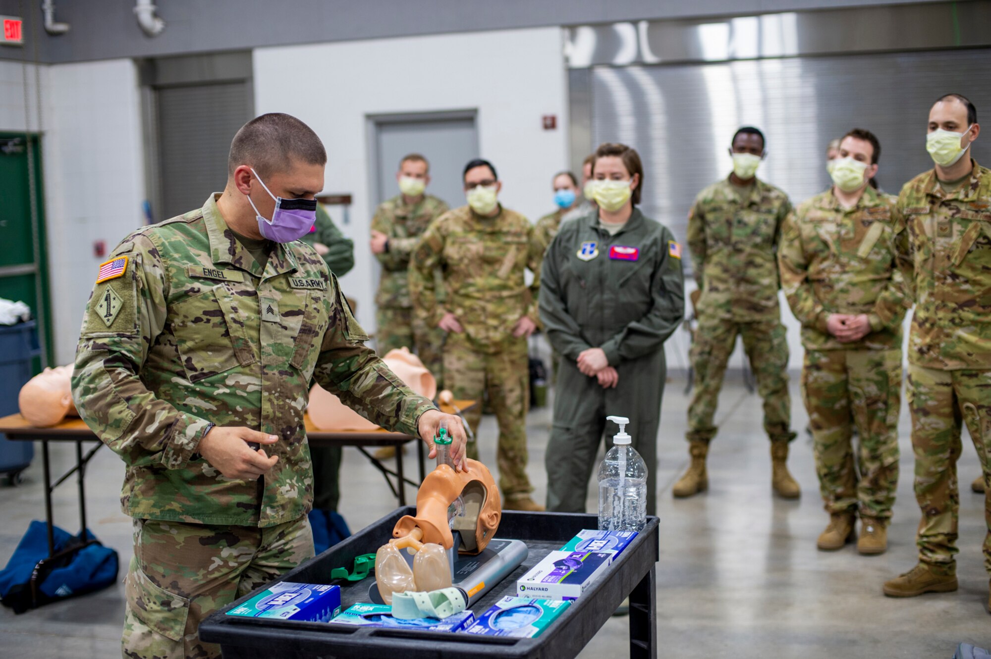 Oklahoma Army National Guard Sgt. Douglas Engle, Comprehensive Medical Training instructor at the Oklahoma Regional Training Institute, demonstrates how to place an advanced airway as part of COVID-19 medical response training at the 90th Troop Command Headquarters in Oklahoma City April 10 - 11. The training will prepare Oklahoma Army and Air National Guard medical personnel to help respond to the outbreak of COVID-19 across the state.