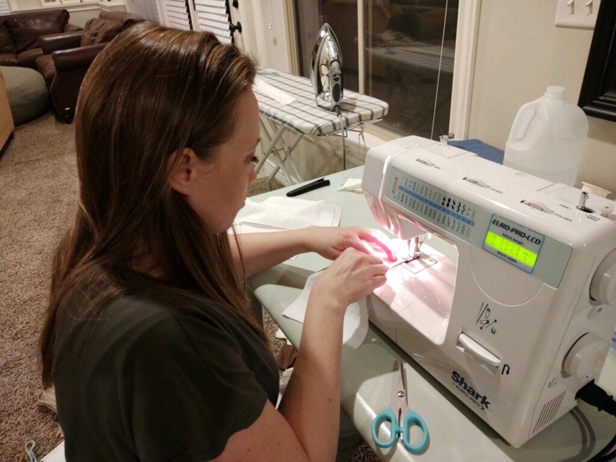 Sara Webb sews face masks that will be donated to the base for Hill Airmen. About 300 volunteers from the local community rallied to sew nearly 20,000 face masks.