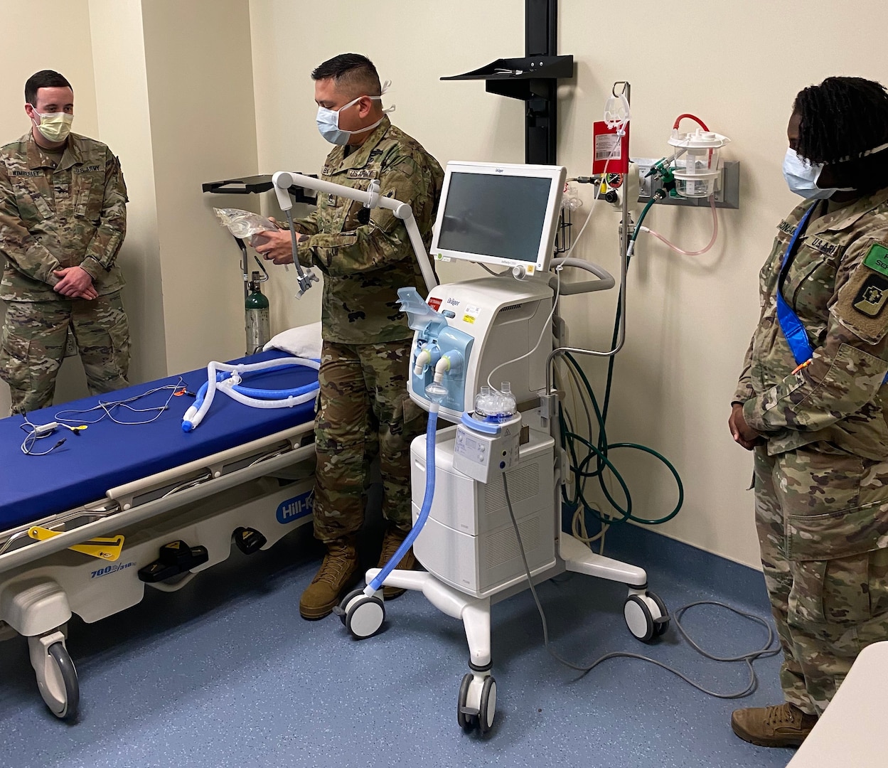 Students and instructors in the Medical Education and Training Respiratory Therapist program practice safe distancing and wear face coverings while training with mechanical ventilators.