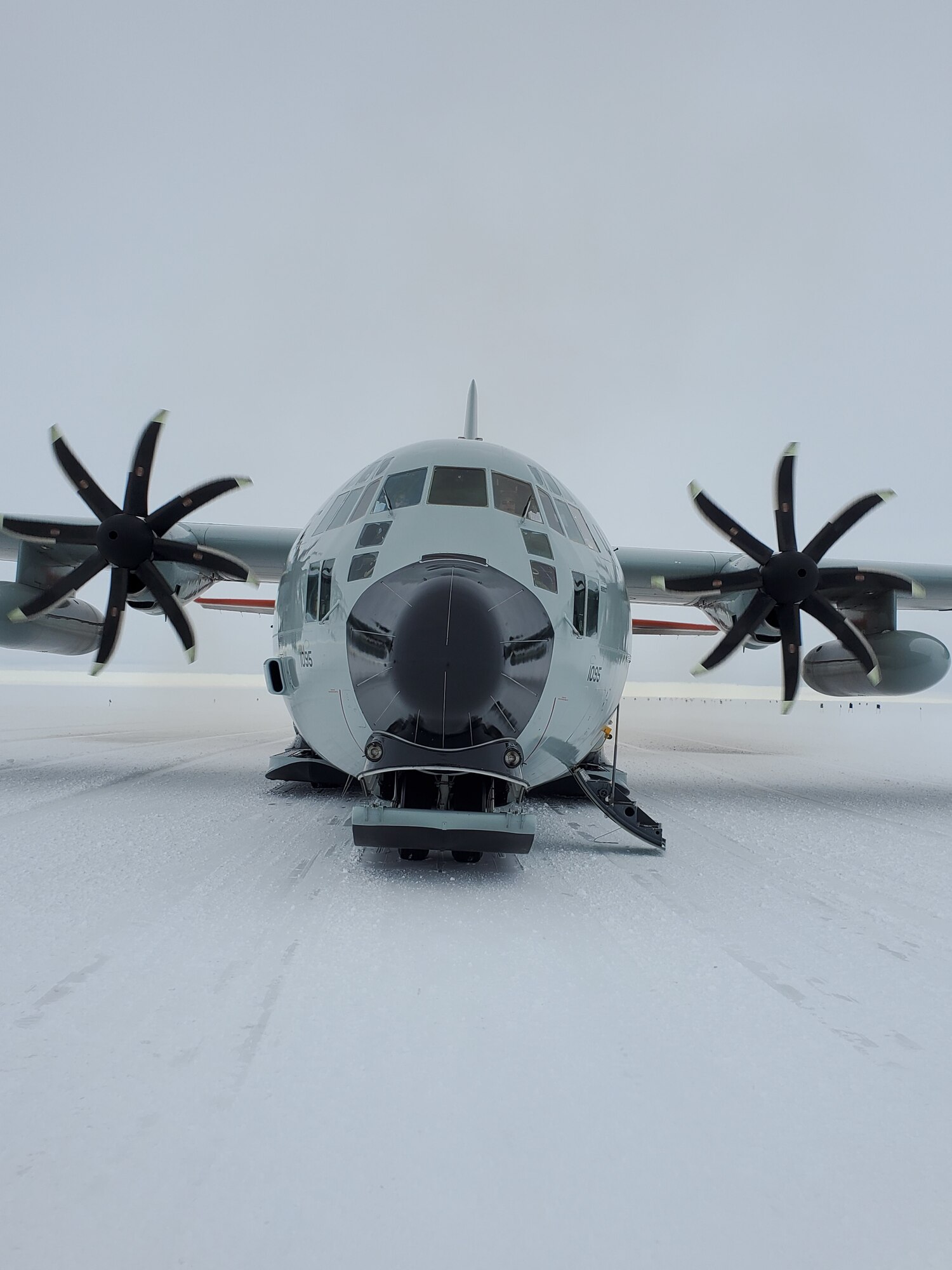 A LC-130 Hercules assigned to the 109th Airlift Wing, New York Air National Guard, sits on an airfield made of snow near the McMurdo Station, Antarctica