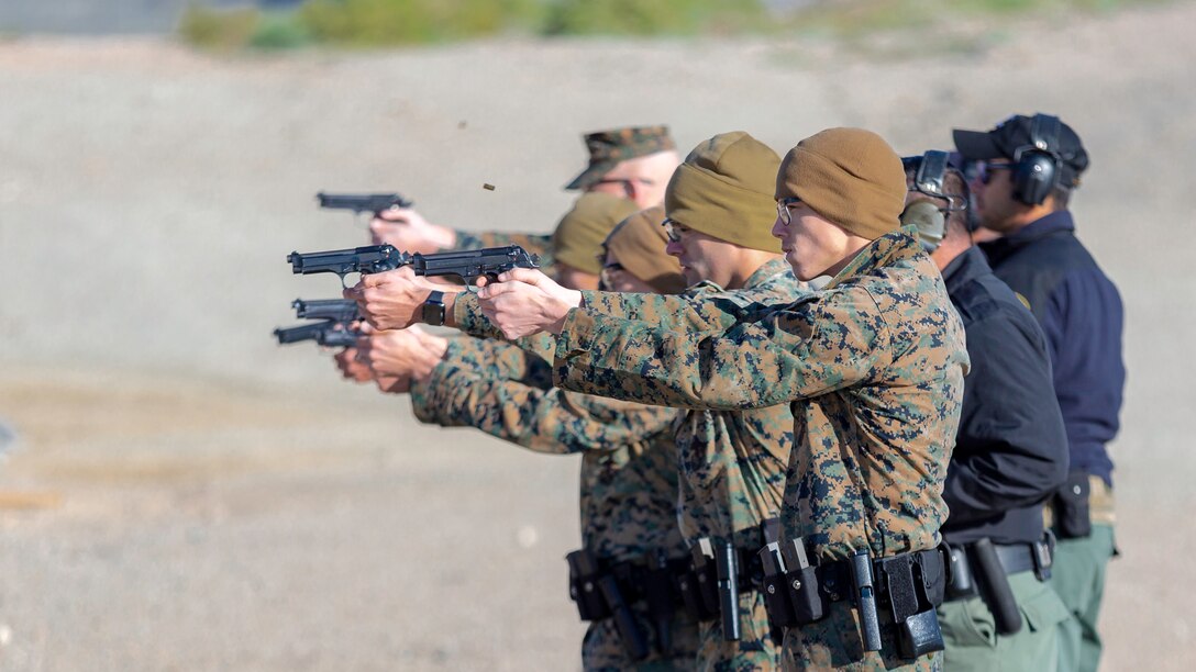 Marines of Marine Corps Logistics Base Barstow lock in on targets during pistol marksmanship training at the range aboard MCLB Barstow, Calif., April 3.
(U.S. Marine photo by Jack J. Adamyk)