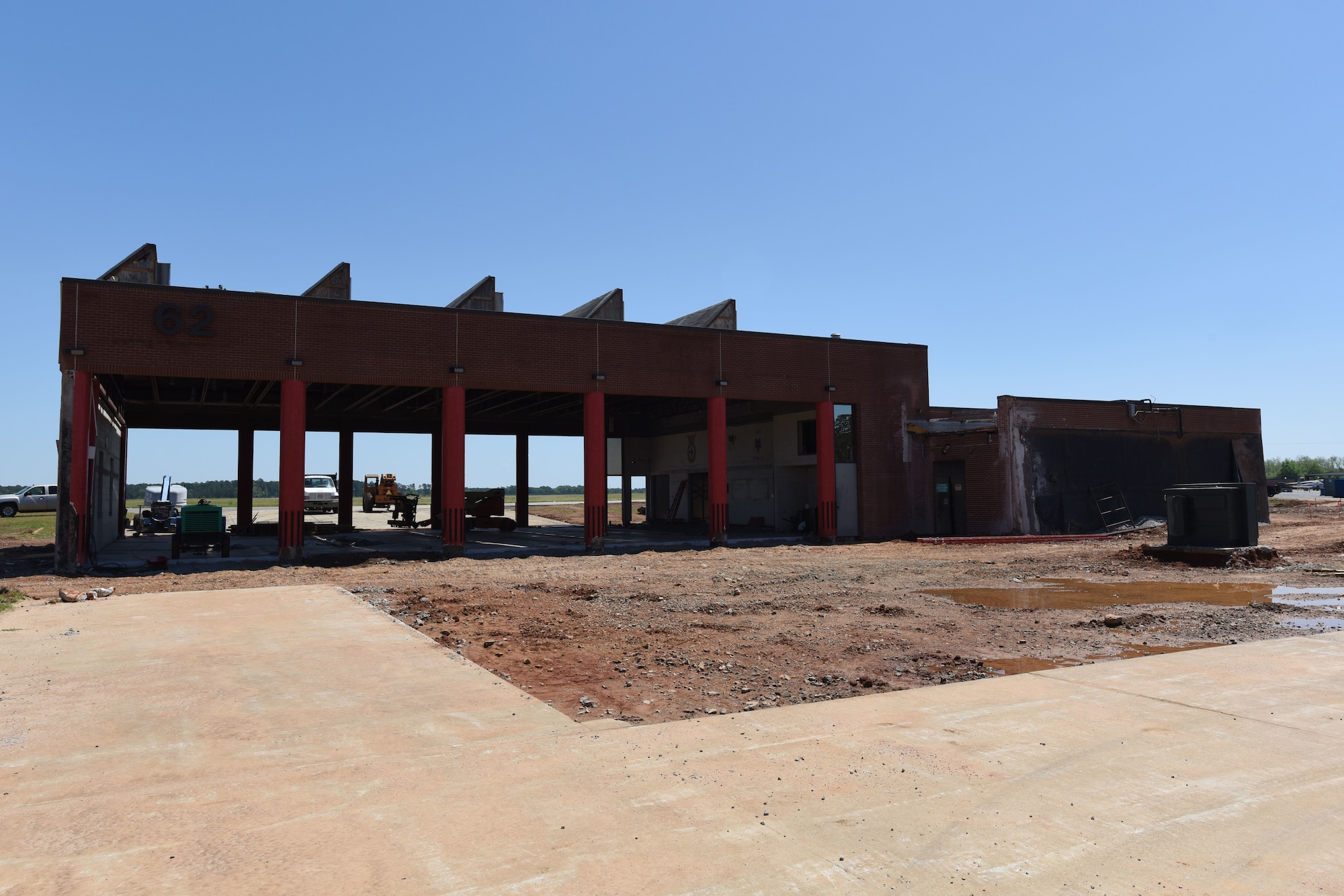 Brick fire station located at McEntire JNGB with blue sky with open truck bays for crash/rescue vehicles