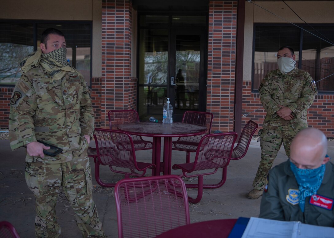 Maj. David Hoff, 39th Airlift Squadron (left), briefs on the day's mission set, prior to the aircrew heading to the flightline on Dyess Air Force Base, Texas, April 9, 2020.