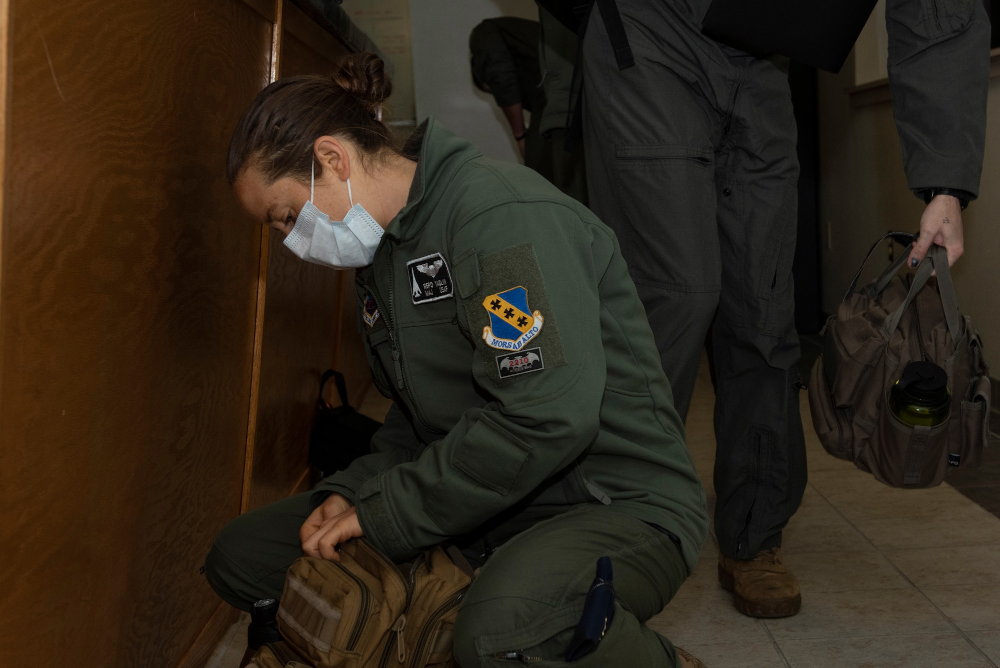 Maj. Roni Yadlin, 9th Bomb Squadron assistant director of operations, preps her bag after a pre-flight brief at Dyess Air Force Base, Texas, April 10, 2020.