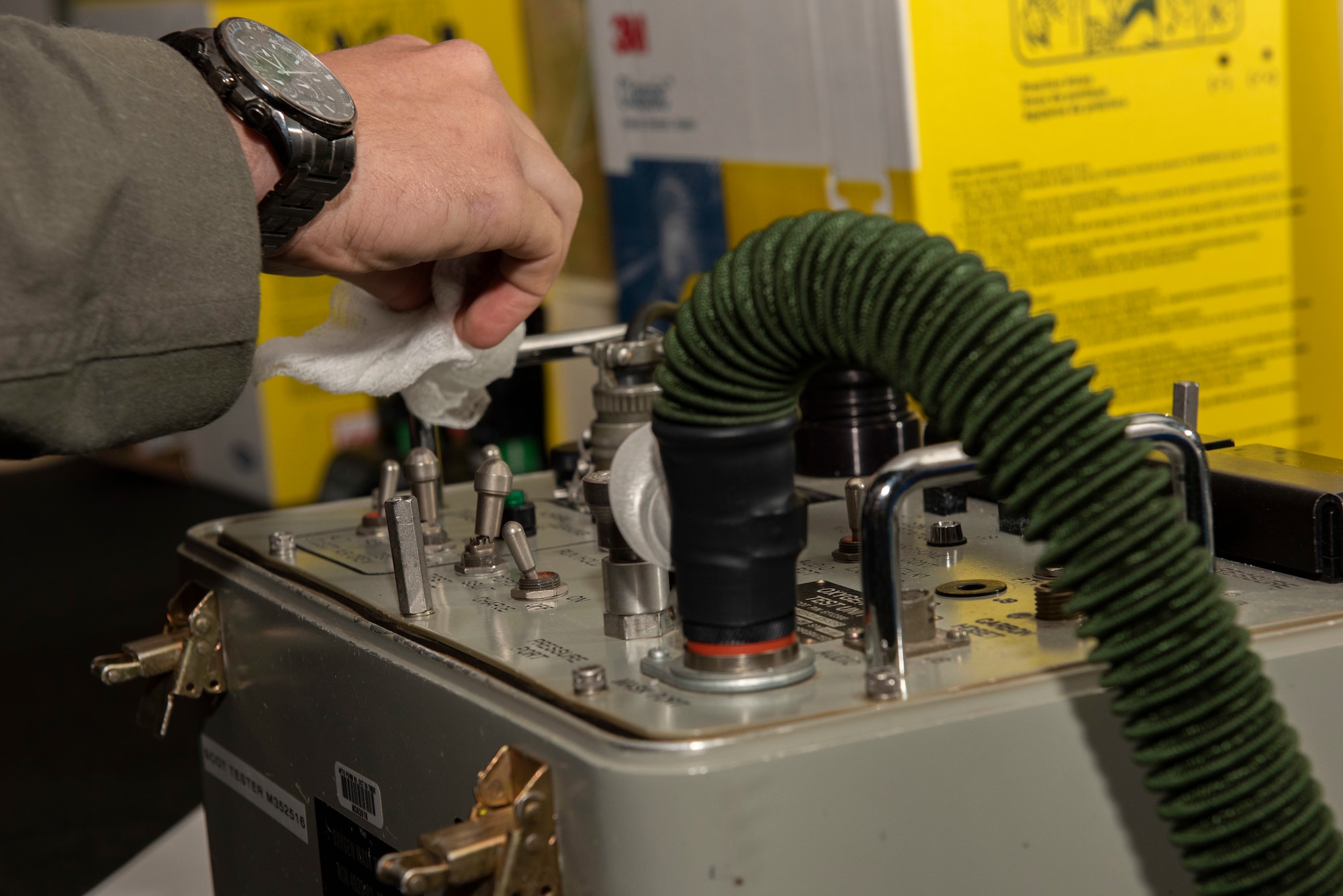 Capt. Clinton Brandt, 9th Bomb Squadron weapon systems operator, sanitizes aircrew flight equipment after using it at Dyess Air Force Base, Texas, April 10, 2020.