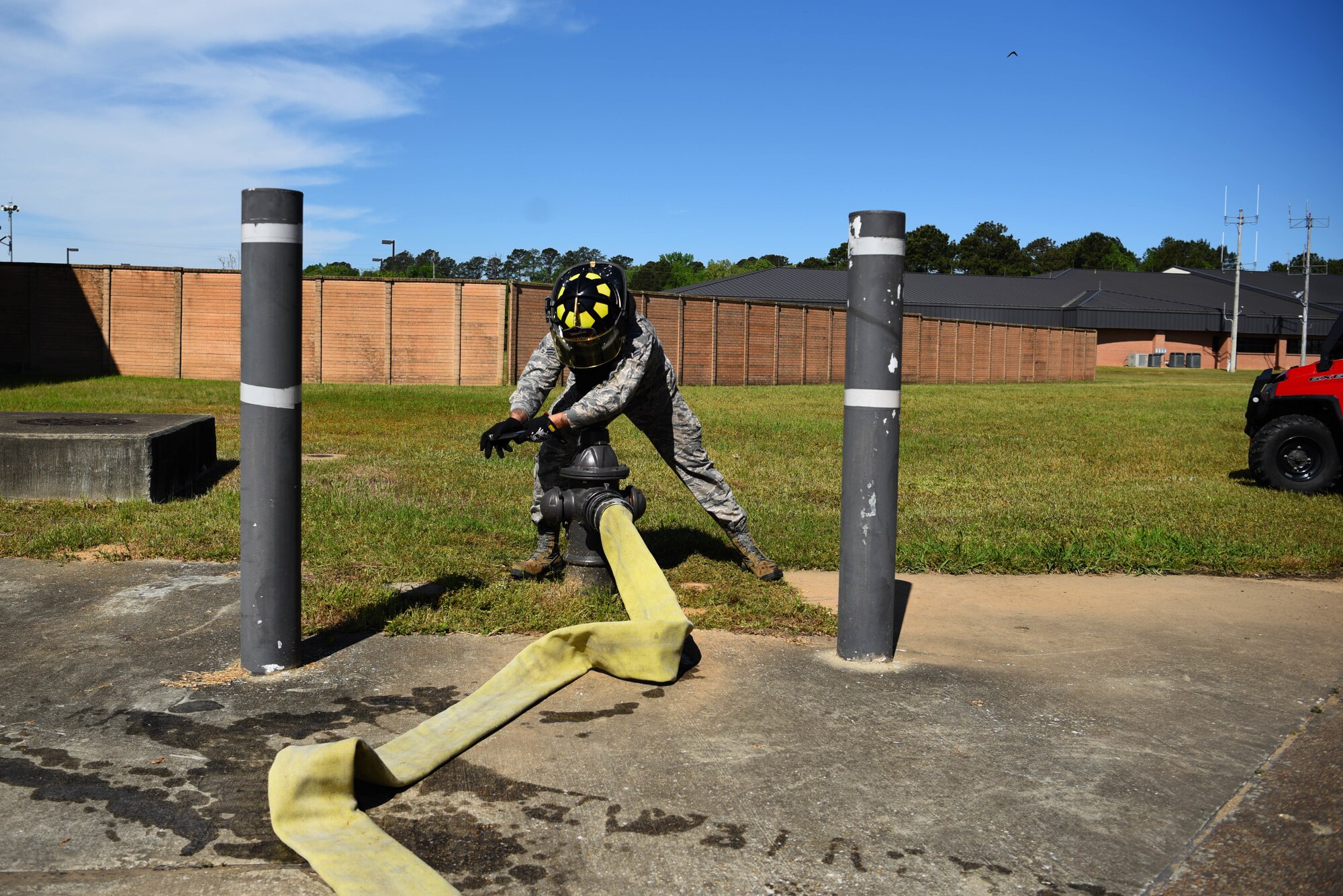 Airman 1st Class Khalil Jeter, 14th Civil Engineer Squadron firefighter, releases water from a fire hydrant April 10, 2020, on Columbus Air Force Base, Miss. A Striker 1500 can hold up to 1,500 gallons of water in them to ensure readiness and the protection of the community in emergency situations. (U.S. Air Force photo by Airman 1st Class Jake Jacobsen)