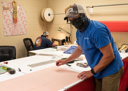 Kenneth Swearingin, left, and Brent Stephens, right, from NSWC PCD’s Rigging Shop are sewing non-medical, Food and Drug Administration (FDA) approved design with two layers of 100% cotton fabric and elastic band in support of protecting NSWC PCD employees from COVID-19.