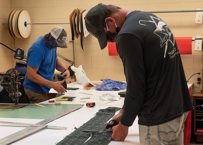 Kenneth Swearingin, Brent Stephens, and Matthew Shackleton from NSWC PCD’s Rigging Shop are sewing non-medical, Food and Drug Administration (FDA) approved design with two layers of 100% cotton fabric and elastic band in support of protecting NSWC PCD employees from COVID-19.