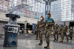 Army Col. Kimberlee Aiello (right), 44th Medical Brigade commanding officer, gives Lt. Gen. Laura Richardson, commanding general of U.S. Army North, a tour of the Javits New York Medical Station, April 12, 2020.