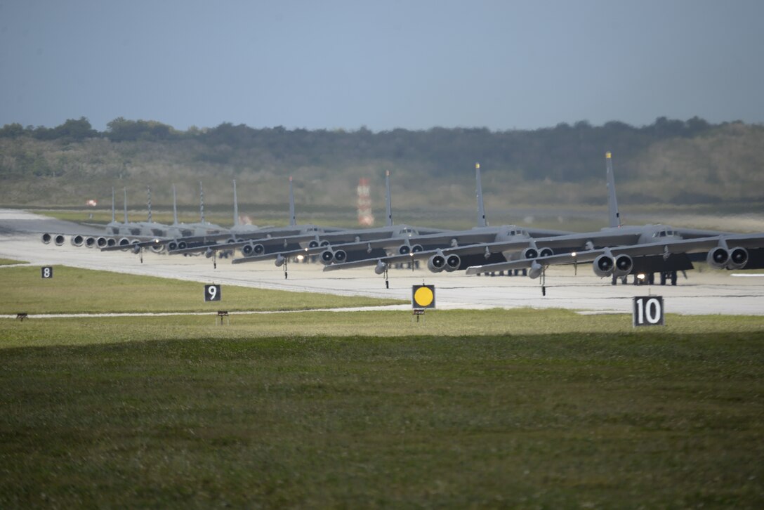 A U.S. Navy MH-60S Knighthawk, MQ-4C Triton, U.S. Air Force RQ-4 Global Hawk, B-52 Stratofortresses, and KC-135 Stratotankers stationed at Andersen Air Force Base, Guam, perform an "Elephant Walk" April 13, 2020.