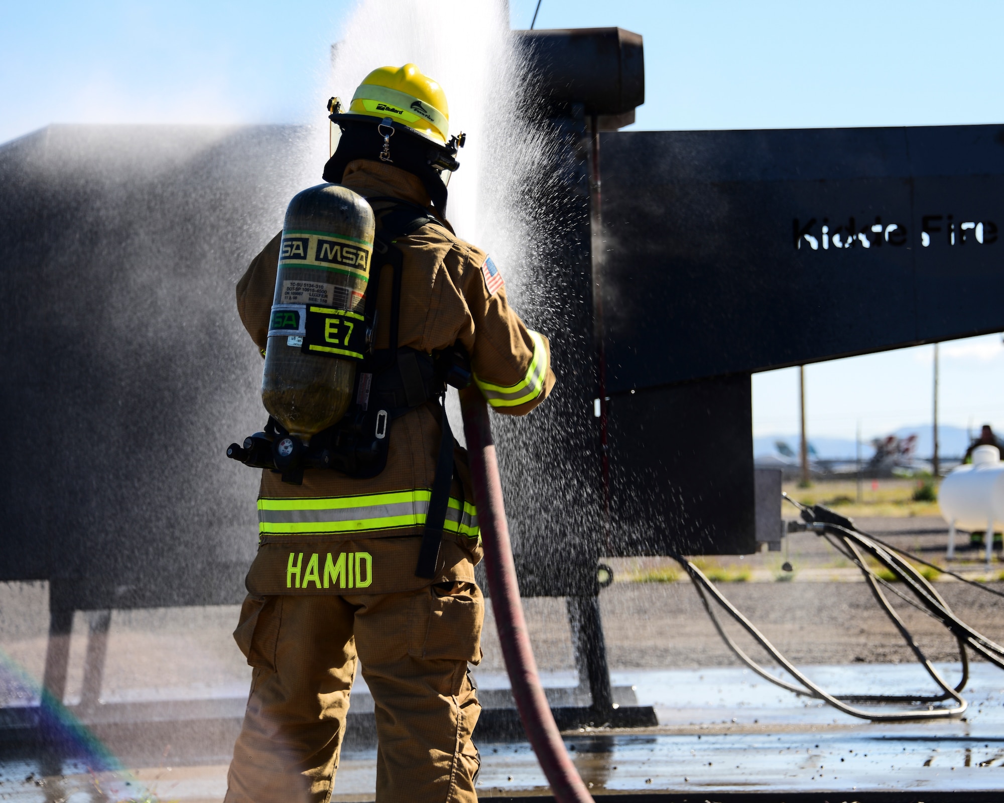 A photo of Airmen fighting fire