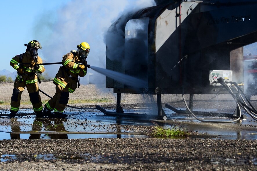 A photo of Airmen fighting fire