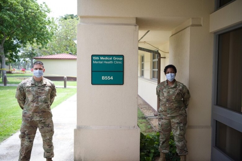 Staff Sgt. Adam Taylor, 15th Medical Operations Squadron mental health technician, with Maj. Tracy Golliday-Corley, 15th MDOS clinical social worker, standby ready to continue assisting Airmen, just in a mostly virtual way due to the COVID-19 pandemic at the 15th Medical Group Mental Health Clinic at Joint Base Pearl Harbor-Hickam, Hawaii, April 10, 2020. The Mental Health Clinic provides Airmen with  tools to overcome mental health challenges. (U.S. Air Force photo by 2nd Lt. Benjamin Aronson)