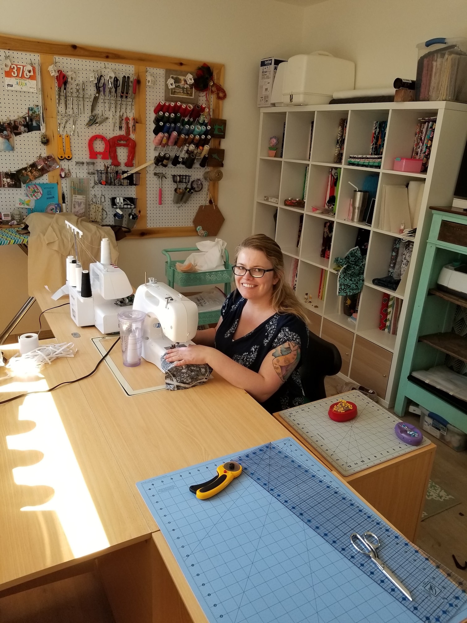 Sarah Schrader, spouse to U.S. Air Force Master Sgt. Jonathon Schrader, 701st Munitions Squadron senior load monitor, sews masks for personnel at Kleine-Brogel Air Base, Belgium, April 6, 2020. Schrader learned to sew from her mother and late grandmother and has been sewing for over 30 years. (Courtesy photo from 701st MUNSS)
