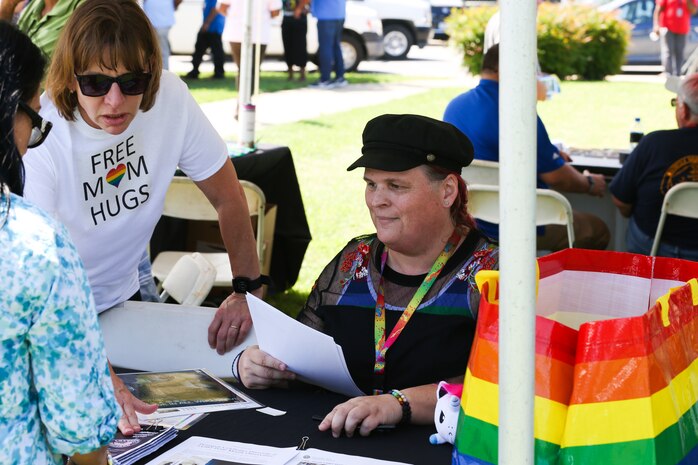 Norfolk Naval Shipyard'sLGBTQ-A ERG Chairperson Cassie Bower promotes the ERG at NNSY’s annual Shipyard Celebration.