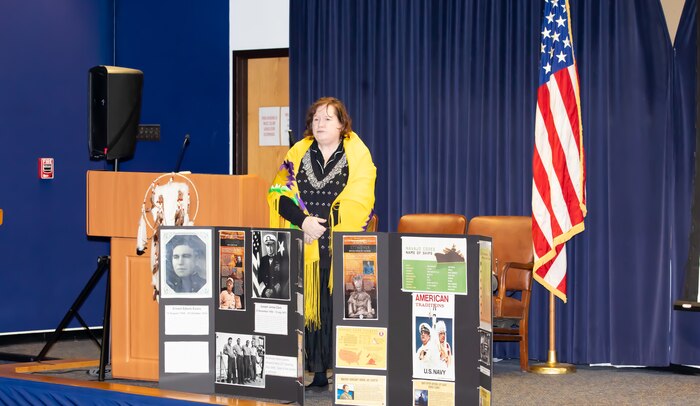 Norfolk Naval Shipyard's Native American Indian Heritage ERG Chairperson Camille Brownell-Sorenson explains displays during a Native American Indian Heritage Month event Nov. 21, 2019