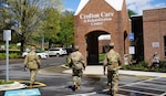 Maryland National Guard members led by Col. Eric Allely, Maryland State Surgeon, arrive at Crofton Care & Rehabilitation Center in Crofton, Maryland, April 9, 2020, to evaluate measures to protect against the spread of COVID-19.