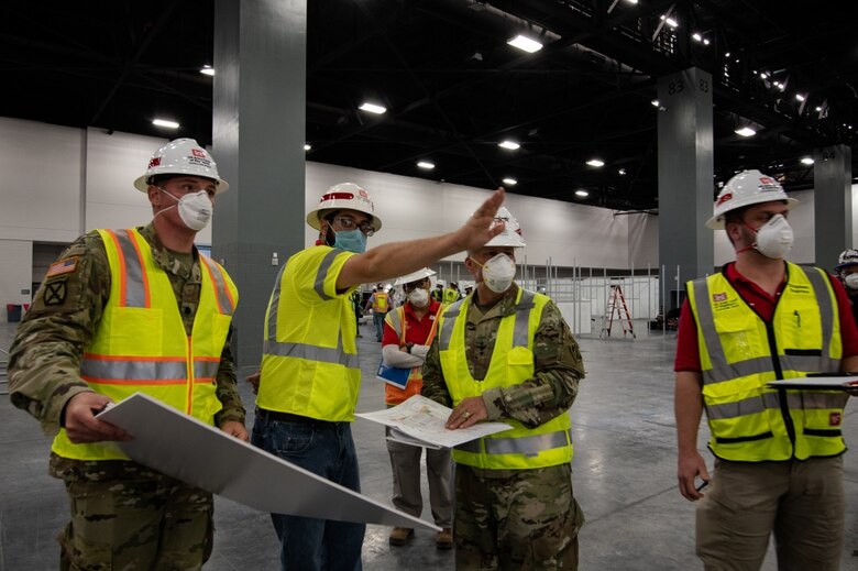 U.S. Army Corps of Engineers, Jacksonville, District deputy commander and senior project manager for the COVID-19 emergency response, Lt. Col. Todd Polk, Corps mechanical engineer, Jason Chapple, and civil engineer, Stephen Dupries brief the Chief Engineer of the U.S. Army Corps of Engineers, Lt. Gen. Todd Semonite on the construction at the Miami Beach Convention Center to convert it to an alternate care facility.