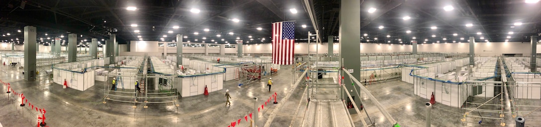 Construction crews erect ICU pods and Acute Care enclosures at the Miami Beach Convention Center. USACE awarded a contract to convert the Miami Beach Convention Center into a 450-bed alternate care facility. The beds will be used to treat COVID-19 patients should the facility be needed.