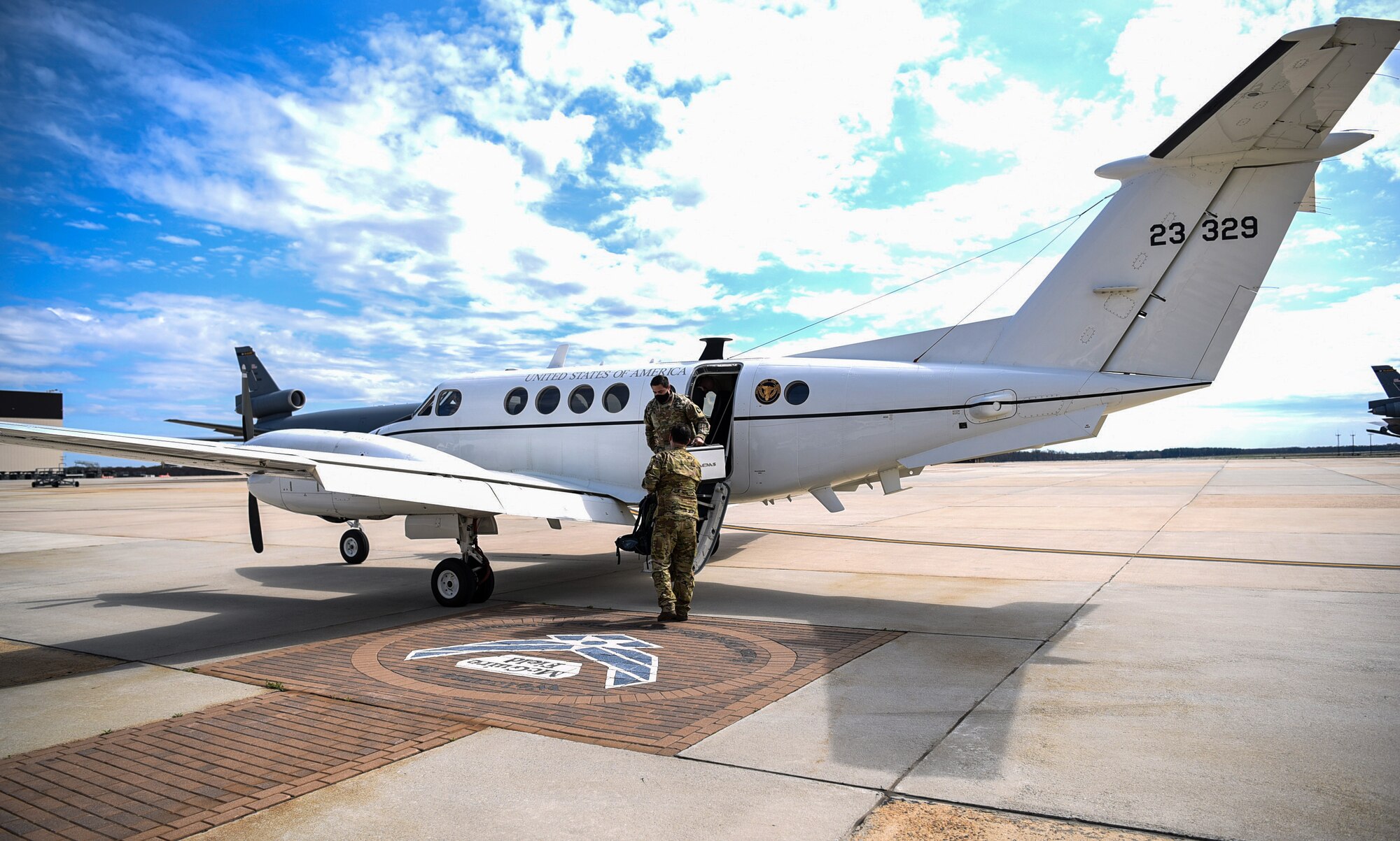 Photo of soldiers disembark an aircraft.