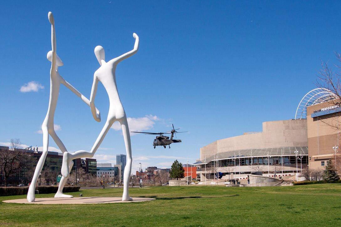A helicopter lands at the Colorado Convention Center.