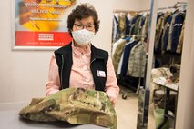 Kum Sun Yun, the manager of Stripes Alterations Shop, poses for a photo at Joint Base Charleston, S.C., April 7, 2020. Employees at Stripes Alterations Shop are taking safety precautions such as wearing masks, cleaning work areas and washing their hands frequently. The hours of operation for alterations are from 9 a.m. to 5 p.m. Monday through Friday and 9 a.m. to 3 p.m. on Saturdays.
