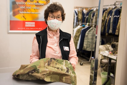 Kum Sun Yun, the manager of Stripes Alterations Shop, poses for a photo at Joint Base Charleston, S.C., April 7, 2020. Employees at Stripes Alterations Shop are taking safety precautions such as wearing masks, cleaning work areas and washing their hands frequently. The hours of operation for alterations are from 9 a.m. to 5 p.m. Monday through Friday and 9 a.m. to 3 p.m. on Saturdays.