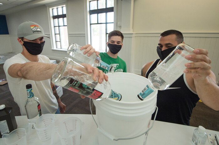 From left to right, Staff Sgt. Devan Trammel, 628th Civil Engineer Squadron explosive ordnance disposal flight team leader, Senior Airman Jacob Smith, 437th Maintenance Squadron aircraft hydraulics journeyman, and Tech. Sgt. Austin Barkdoll, 373rd Training Squadron, Detachment 5 instructor element NCOIC, all Palmetto Spark innovation lab members, prepare ingredients to produce hand sanitizer in an effort to support mission essential personnel and combat health risks associated with the COVID-19 pandemic, at Joint Base Charleston, S.C., April 10, 2020. The innovation team, Palmetto Spark, is comprised of Airmen from across JB Charleston. Their mission is to enable Airmen to solve problems they face day-to-day.