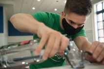 Senior Airman Jacob Smith, 437th Maintenance Squadron aircraft hydraulics journeyman and Palmetto Spark innovation lab member, prepares ingredients to produce hand sanitizer in an effort to support mission essential personnel and combat health risks associated with the COVID-19 pandemic, at Joint Base Charleston, S.C., April 10, 2020. The innovation team, Palmetto Spark, is comprised of Airmen from across JB Charleston. Their mission is to enable Airmen to solve problems they face day-to-day.