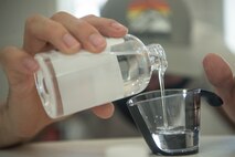 Staff Sgt. Devan Trammel, 628th Civil Engineer Squadron explosive ordnance disposal flight team leader and Palmetto Spark innovation lab member, prepares ingredients to produce hand sanitizer in an effort to support mission essential personnel and combat health risks associated with the COVID-19 pandemic, at Joint Base Charleston, S.C., April 10, 2020. The innovation team, Palmetto Spark, is comprised of Airmen from across JB Charleston. Their mission is to enable Airmen to solve problems they face day-to-day.