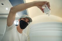 Staff Sgt. Devan Trammel, 628th Civil Engineer Squadron explosive ordnance disposal flight team leader and Palmetto Spark innovation lab member, prepare ingredients to produce hand sanitizer in an effort to support mission essential personnel and combat health risks associated with the COVID-19 pandemic, at Joint Base Charleston, S.C., April 10, 2020. The innovation team, Palmetto Spark, is comprised of Airmen from across JB Charleston. Their mission is to enable Airmen to solve problems they face day-to-day.